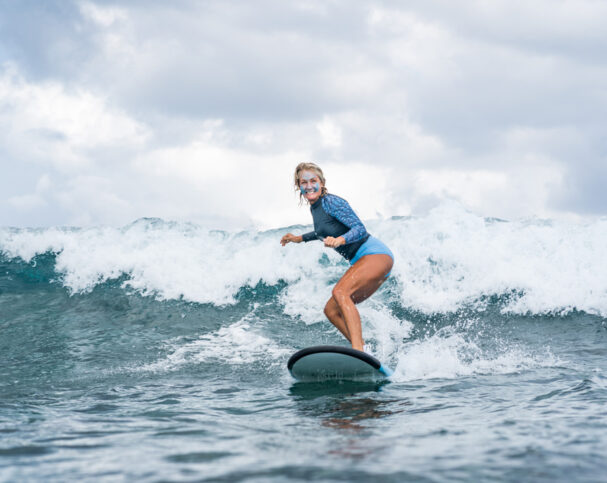 person learning to surf for the first time